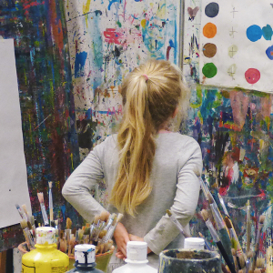 A young girl painting