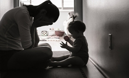 Tired mother with child