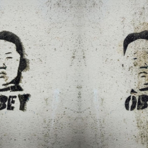 Graffiti of Kim Jong-un with the word 'Obey' underneath