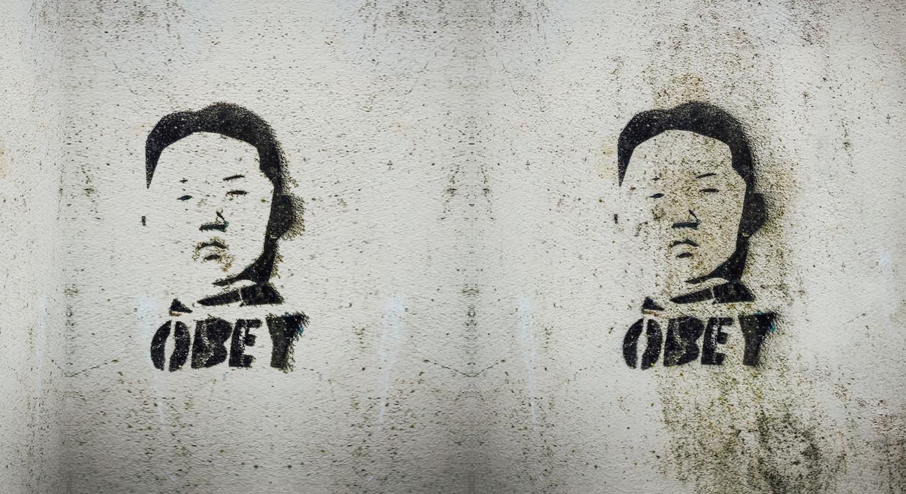 Graffiti of Kim Jong-un with the word 'Obey' underneath