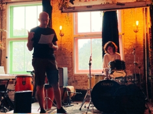 A photo of author Dan McQuillan speaking at an Anti-University Now event at The Jago in London.